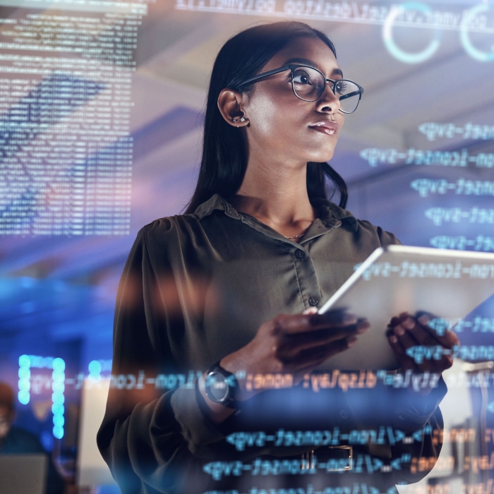 Software, coding hologram and woman on tablet thinking of data analytics, digital technology and night overlay. Programmer or IT person in glasses on 3d screen, programming and cybersecurity research