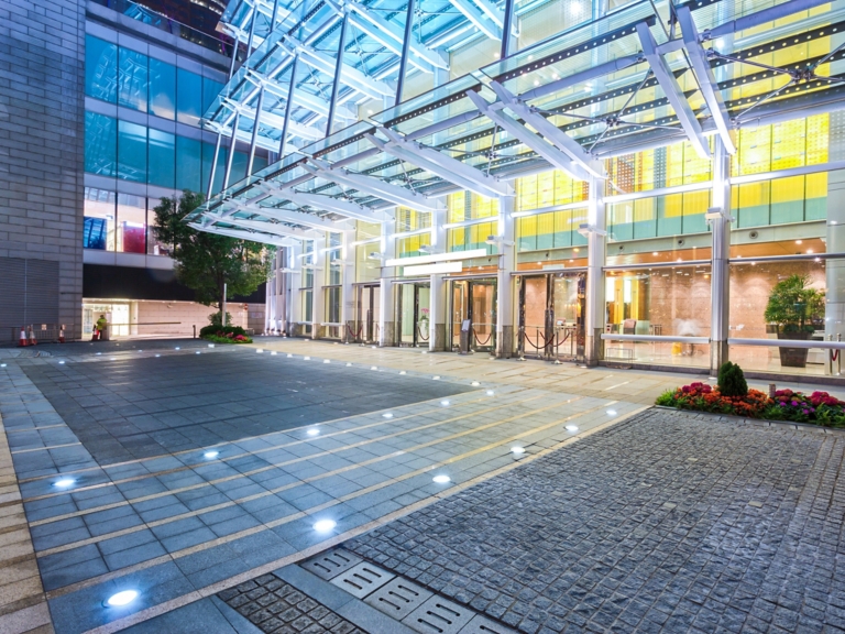 Empty floor near modern building facade