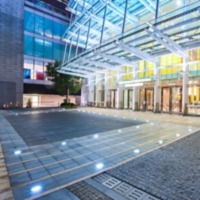Empty floor near modern building facade
