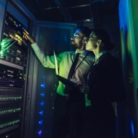 Man and woman in data centre