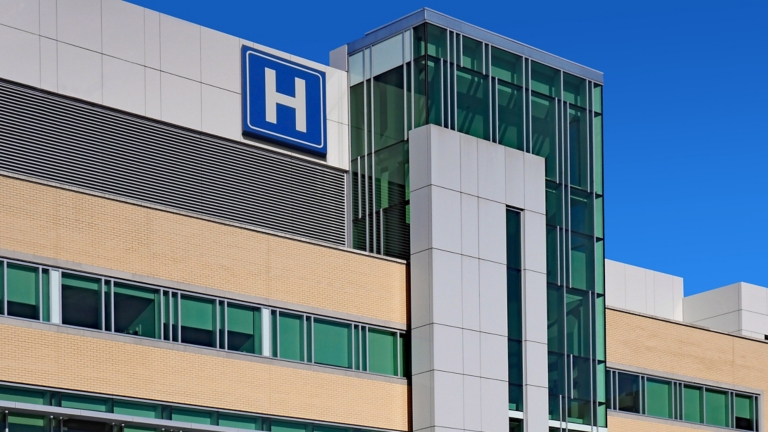Modern style building with large H sign for hospital