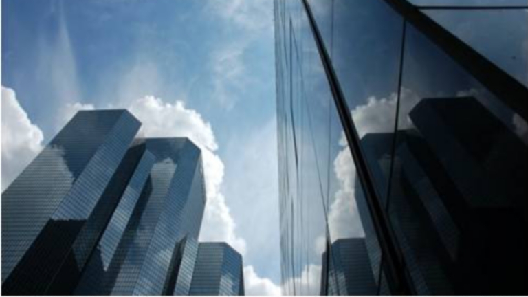 Upward view of skyscrapers.