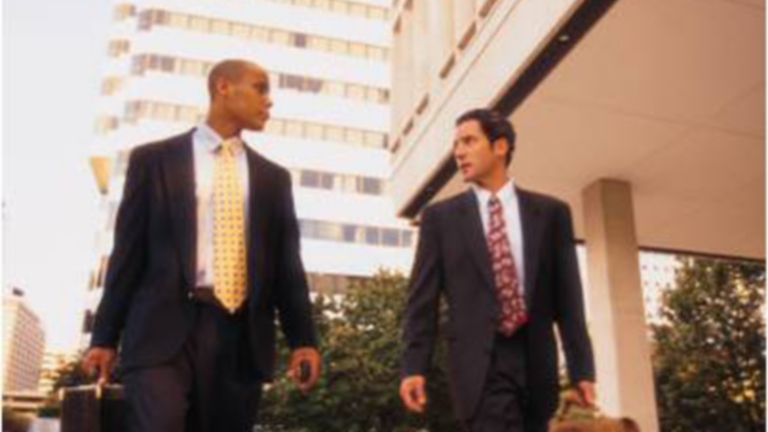 Businessmen walking on street