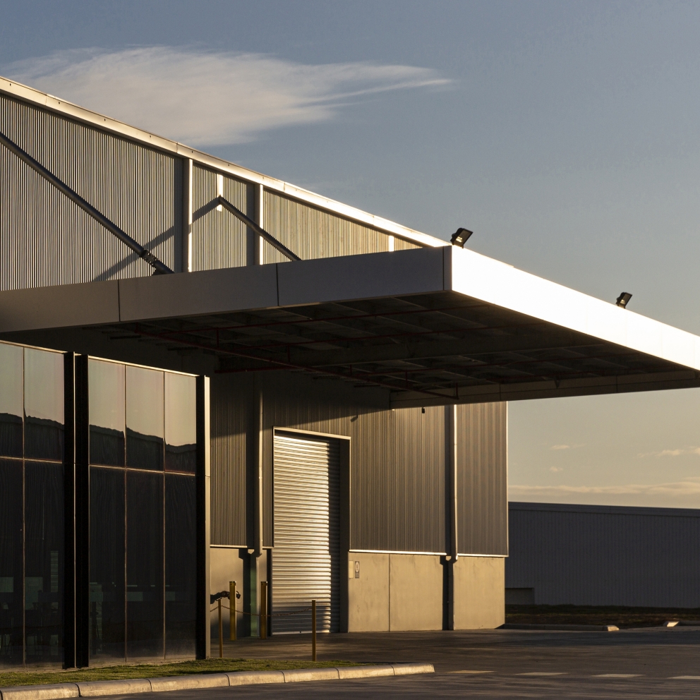 Industrial office & warehouse architecture bathed in afternoon light.