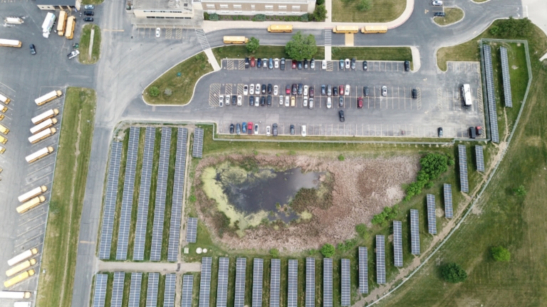 Birds eye view of solar panels and the school