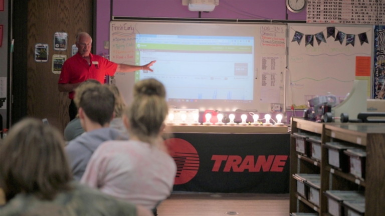 Manufacturing professional teaches students