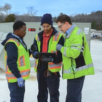 Symbio Technicians Working Together on roof