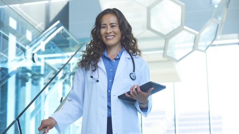 Doctor in Stairwell with Tablet
