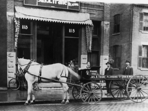 Trane Company carriage in front of building