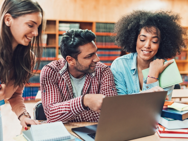 people smiling in library
